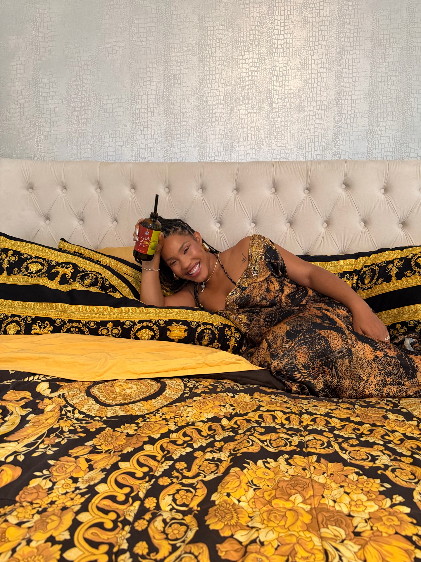 Woman relaxing with Apple of Eve in a home setting